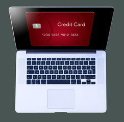 A generic red credit card is seen  from above on the screen of an open laptop computer in a 3-d illustration about online purchases and credit cards.