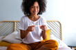 © Daniel - Happy young multiracial woman checking pregnancy test. Pregnancy.