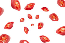 Falling Sliced Red Hot Chilli Peppers Isolated On White Background, Selective Focus