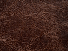 Genuine Luxury Dark Brown Vintage Leather Texture Sample. Textured Backdrop Or Background Effective For Design, Upholstered Furniture, Clothing Industry With Place For Text. Faux Eco Leather.