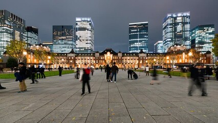 Wall Mural - Night timelapse of Japanese people, Asia traveler walk at Tokyo Station building in Tokyo. Japan train transportation, Asia travel tourism landmark, tourist attraction, Asian city life concept