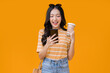 surprise sms celebrate message greeting from smartphone screen,happiness asian young adult woman hand hold cellphone and reading good news from her friend hand gesture studio shot