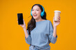 © whyframeshot - carefree leisure coffee break with freshness enjoy moment with headphone music melody,asia woman teen smiling cheerful  hand using smartphone  chat communication while take a break with music coffee