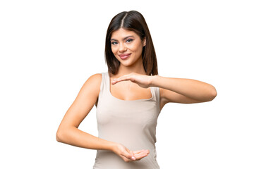Wall Mural - Young Russian woman over isolated chroma key background holding copyspace imaginary on the palm to insert an ad