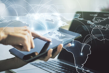 Wall Mural - double exposure of abstract digital world map with connections and hand working with a digital table