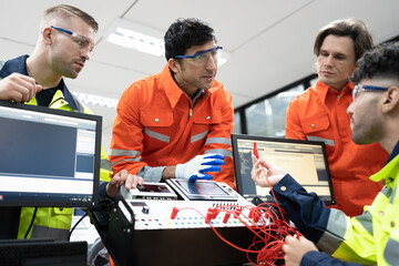 Two Caucasian engineer man learning with electric and computer programming in class	
