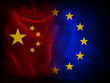 © Julien - Chinese vs European Union flags illustration on a black textured fabric background representing tensions, economic and political war between Europe and China