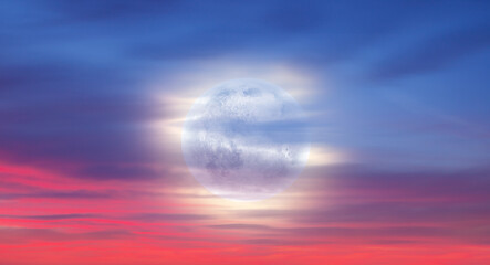 Wall Mural - Sunset sky with full moon in the clouds 