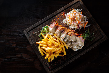 Wall Mural - baked meat in mushroom sauce with potato and salad