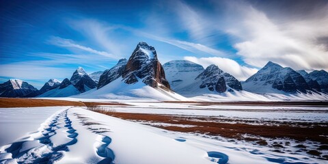 Poster - A snow covered plain with snowy mountains in the background. 