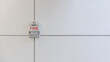 A fire alarm with built in strobe light to alert in case of fire. A sound and strobe fire alarm is mounted to an interior wall as part of the fire alarm system