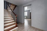 Fototapeta Morze - Modern natural ash tree wooden stairs in new house interior