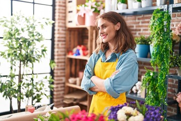 Sticker - Young beautiful hispanic woman florist smiling confident standing with arms crossed gesture at florist