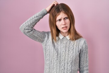 Sticker - Beautiful woman standing over pink background confuse and wondering about question. uncertain with doubt, thinking with hand on head. pensive concept.