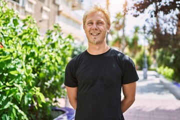 Sticker - Young caucasian man smiling confident at street