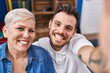 © Krakenimages.com - Mother and son make selfie by the camera sitting on sofa at home