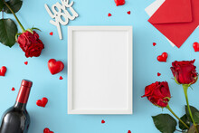 Valentines Day Concept. Flat Lay Composition Made Of Red Roses, Wine Bottle, Envelope, Red Hearts, Inscription Love You On Pastel Blue Background And Frame In The Middle. Lovers Holiday Card Idea.