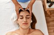 © Krakenimages.com - Two women therapist and patient having facial massage session at beauty center