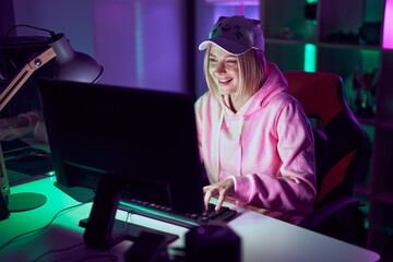 Canvas Print - Young blonde woman streamer using computer at gaming room