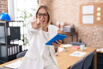 Canvas Print - Young caucasian woman working at the office wearing glasses pointing displeased and frustrated to the camera, angry and furious with you