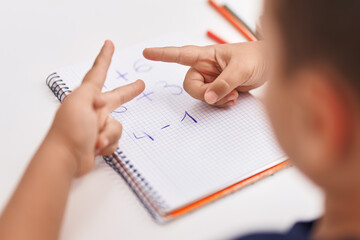 Sticker - Adorable hispanic toddler doing mathematics exercise counting with fingers at classroom