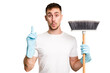 © Asier - Young man holding a broom to clean his house cut out isolated having some great idea, concept of creativity.