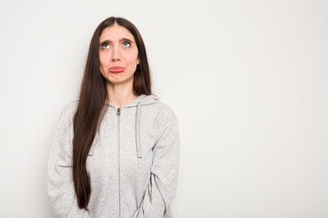 Wall Mural - Young caucasian woman isolated on white background shouting very angry, rage concept, frustrated.