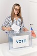 © Krakenimages.com - Young chinese woman smiling confident voting at electoral college
