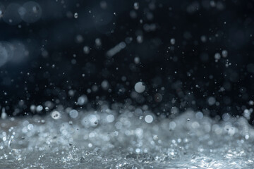 Wall Mural - Macro photography of rain on a black background. Abstract background.