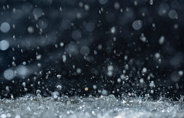 Wall Mural - Macro photography of rain on a black background. Abstract background.