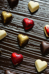 Canvas Print - chocolate hearts on the dark background