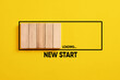 © Cagkan - Waiting or preparing for a new start in business career or life. New start loading progress bar on yellow background.