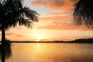 Wall Mural - deep moody sunrise over bay