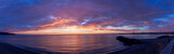 Fototapeta Zachód słońca - view at sunrise or sunset in sea with nice beach , surf , calm water and beautiful clouds on a background of a sea landscape
