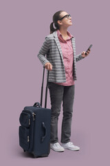 Wall Mural - Woman traveling and using a smartphone