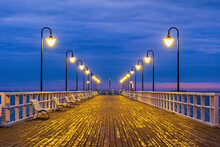 Poland, Pomerania, Gdynia, Illuminated Orlowo Pier At Dawn
