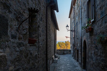Italy, Lazio, Bolsena, Narrow Alley Between Old Stone Houses