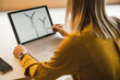 © Westend61 - Businesswoman drawing wind turbine on laptop
