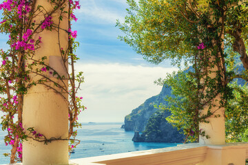 Wall Mural - Beautiful view of Amalfi coast from antique terrace with flowers. Popular summer vacation resort