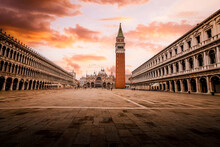 St. Mark's Square (Piazza San Marco) In Venice With Few People And Birds In Flight At Dawn