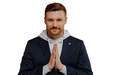 Serious bearded adult man keeps palms pressed together prays for something looks directly at camera believes in something good happen poses against white background. Handsome guy makes request