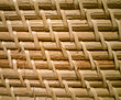 Close-up photo, natural textured bamboo basket surface. Blank background, rattan or reed. Beautiful natural material backdrop, clean, light colors. Traditional Asian crafts.