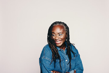 Wall Mural - Mature woman with dreadlocks looking away with a happy smile