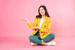 © Timeimage - Image of young Asian business woman sitting on background