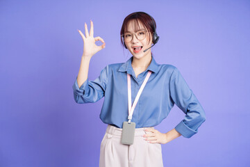 Wall Mural - Image of young Asian woman customer service