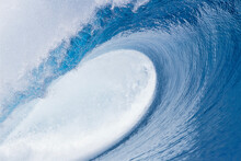 A Big Tubing Wave At Teahupoo, On The Island Of Tahiti In French Polynesia.