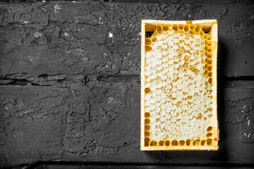 Wall Mural - Honey in wooden honeycombs .