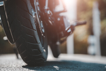 Classic american motorcycle. motorcycle in a sunny motorbike on the road riding.with sunset light. copy space for your individual text.On the road. Wheel bike.