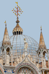 Wall Mural - View over decoration elements at roofs and cupolas of Basilica San Marco in Venice, Italy, at sunny day and deep blue sky.