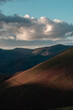 © Ivan - Sunset landscape of mountains and pink clouds in the azure sky
